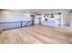 Open-concept living area with hardwood floors and a view into the kitchen at 680 Tubman Dr, Elizabeth, CO 80107