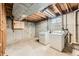 Unfinished basement laundry area with washer and dryer hookups, ready for your custom design at 1431 S Chambers Cir, Aurora, CO 80012