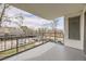 A cozy balcony with black wrought iron railings provides a private outdoor space with neighborhood views at 2325 S Linden Ct # 201, Denver, CO 80222