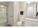 Bathroom with a tiled walk-in shower and granite countertops at 145 Capulin Pl, Castle Rock, CO 80108