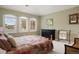 Bright bedroom with large windows, vaulted ceiling, and colorful quilt on the bed at 145 Capulin Pl, Castle Rock, CO 80108