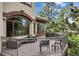 Expansive outdoor deck showcasing picturesque views, lounge seating, and elegant metal railing at 145 Capulin Pl, Castle Rock, CO 80108