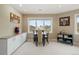 Bright dining area featuring a picture window and built-in cabinets at 145 Capulin Pl, Castle Rock, CO 80108