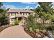 Stunning two-story home featuring a tile roof, beautiful landscaping, and a private circular driveway at 145 Capulin Pl, Castle Rock, CO 80108