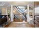 Grand foyer with curved staircase, high ceilings, and views to the dining and living areas at 145 Capulin Pl, Castle Rock, CO 80108