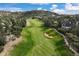 Scenic aerial view of a well-manicured golf course nestled among residential homes at 145 Capulin Pl, Castle Rock, CO 80108