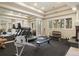 Home gym featuring gym equipment, a fireplace and an outside view at 145 Capulin Pl, Castle Rock, CO 80108