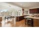 Bright kitchen featuring a dining nook with beautiful views, hardwood floors, and an island with seating at 145 Capulin Pl, Castle Rock, CO 80108