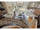 Bright living room featuring large windows, high ceilings, and a beautiful staircase at 145 Capulin Pl, Castle Rock, CO 80108