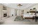 Main bedroom featuring a stone fireplace, tray ceiling and a large window providing a great view at 145 Capulin Pl, Castle Rock, CO 80108