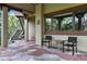 Covered patio area featuring stone flooring, neutral walls, and outdoor seating at 145 Capulin Pl, Castle Rock, CO 80108