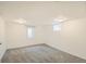 Finished basement offering ample space with neutral carpeting and freshly painted walls at 5669 Johnson Ct, Arvada, CO 80002