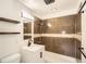 Remodeled bathroom with a stylish vanity, modern fixtures, and a tiled shower-bath at 5669 Johnson Ct, Arvada, CO 80002