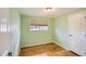 Bedroom featuring stylish window coverings and beautiful hardwood floors at 5669 Johnson Ct, Arvada, CO 80002