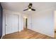 A cozy bedroom showcasing hardwood floors and a double door closet for storage convenience at 5669 Johnson Ct, Arvada, CO 80002