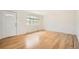 Bright living room with hardwood floors, a large window, and fresh paint at 5669 Johnson Ct, Arvada, CO 80002