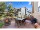 Inviting backyard patio area with a fire pit, dining table, and comfortable seating at 4236 Frederick Cir, Longmont, CO 80503
