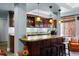 Charming bar area featuring granite countertops, pendant lighting, and ample storage at 4236 Frederick Cir, Longmont, CO 80503
