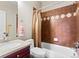 Bathroom featuring a tiled shower and tub combination and single sink vanity at 4236 Frederick Cir, Longmont, CO 80503