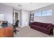Bedroom featuring a sofa and windows for natural light at 4236 Frederick Cir, Longmont, CO 80503