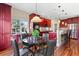 Dining area featuring dark wood cabinets, stainless steel appliances, and a view of the kitchen at 4236 Frederick Cir, Longmont, CO 80503