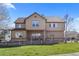 Well-maintained home with a spacious yard, covered patio, and charming wood fence at 4236 Frederick Cir, Longmont, CO 80503