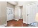 Foyer with decorative glass front door and sidelights, and tile flooring at 4236 Frederick Cir, Longmont, CO 80503