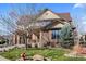 Beautiful two-story home with a well-maintained lawn and a combination of stone and siding exterior at 4236 Frederick Cir, Longmont, CO 80503
