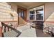 Inviting front porch with a comfortable bench, perfect for enjoying the outdoors at 4236 Frederick Cir, Longmont, CO 80503