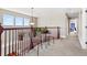 Upstairs hallway featuring a seating area and views of the yard at 4236 Frederick Cir, Longmont, CO 80503