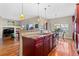 Spacious kitchen with a large center island, modern lighting, and stainless steel appliances at 4236 Frederick Cir, Longmont, CO 80503