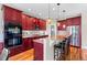 Modern kitchen with a large island, granite countertops, and stainless steel appliances at 4236 Frederick Cir, Longmont, CO 80503