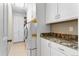 Functional laundry room with a washer, dryer, and plenty of storage at 4236 Frederick Cir, Longmont, CO 80503