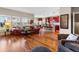 Open concept living room with hardwood floors and view of the eat in kitchen at 4236 Frederick Cir, Longmont, CO 80503