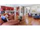 Inviting living room with hardwood floors, burgundy cabinets, and a comfortable leather sofa at 4236 Frederick Cir, Longmont, CO 80503