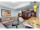 Inviting living room with a granite bar top, entertainment center, and a comfortable couch at 4236 Frederick Cir, Longmont, CO 80503