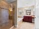 Bathroom features a glass door shower, soaking tub and cherry wood vanity at 4236 Frederick Cir, Longmont, CO 80503
