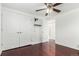 Well-lit bedroom with hardwood floors and double doors at 7511 Niagara St, Commerce City, CO 80022