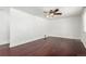 Large bedroom with hardwood floors and ceiling fan at 7511 Niagara St, Commerce City, CO 80022