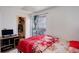 Bright bedroom with a window, closet and furniture at 1123 S Biscay St, Aurora, CO 80017