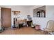 Dining area features wood floors, a long table, and natural light at 1123 S Biscay St, Aurora, CO 80017