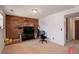 Living room with a red brick accent wall with a television on top at 1123 S Biscay St, Aurora, CO 80017