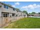 Large, private backyard with wood fence separating the yard from the community pool at 1203 S Zeno Way # B, Aurora, CO 80017