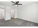 Spacious bedroom with neutral carpet, a ceiling fan and ample closet space at 1203 S Zeno Way # B, Aurora, CO 80017