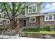 Charming townhome with stone accents, inviting curb appeal, and a well-manicured front yard at 1203 S Zeno Way # B, Aurora, CO 80017