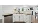 Bright kitchen featuring stainless steel appliances, granite countertops, and white cabinets at 1203 S Zeno Way # B, Aurora, CO 80017