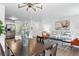 Open living space with modern decor, including a dining area, living room, and kitchen view at 1203 S Zeno Way # B, Aurora, CO 80017