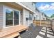 Rear patio and backyard featuring privacy fence, pavers and mulched garden bed at 1203 S Zeno Way # B, Aurora, CO 80017