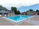 Community pool with lounge seating, trees, and clubhouse at 1203 S Zeno Way # B, Aurora, CO 80017