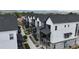 Aerial view showcases modern townhomes, offering a glimpse of community and mountain views at 5189 Vivian St, Wheat Ridge, CO 80033